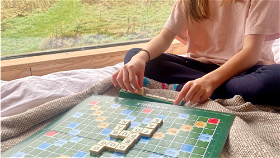 Playing scrabble at Unplugged cabin