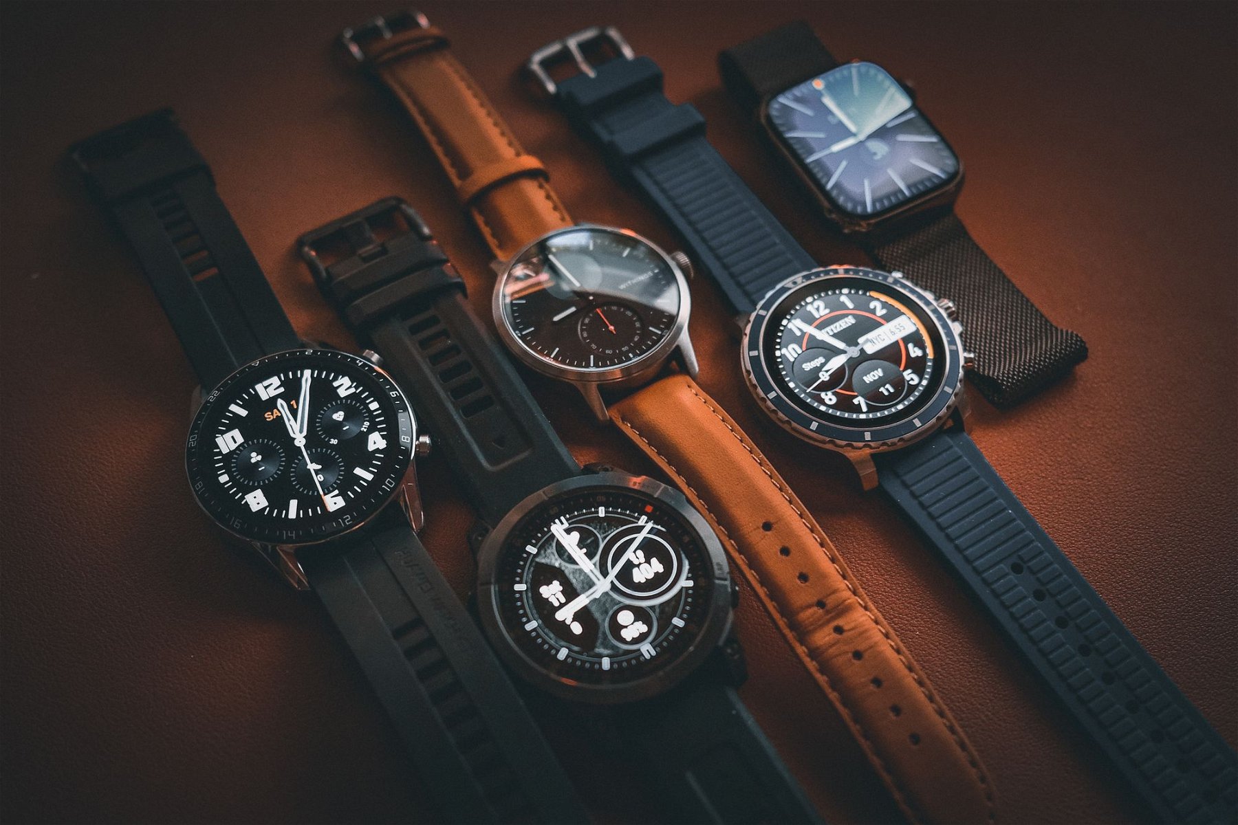 A photo of my very ordinary smartwatch collection. Taken with my Fujifilm X100V. Edited for effect in Lightroom.